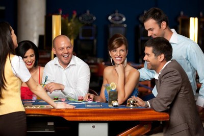 Entertainment Casino photodune 2330509 laughing friends playing cards in a casino l